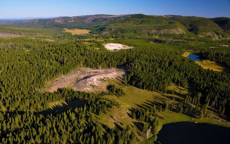 An aerial view of the area in the Landsat 8 nighttime image shows the new thermal area (center left) that R. Greg Vaughan spotted in the Landsat image. The existing Tern Lake Thermal Area is the bright white patch of ground in the upper middle part of the image. West Tern Lake is the dark area in the lower right, and Tern Lake is above that. Photo credit: Michael Poland, USGS